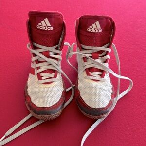 Adidas boys used size 3.5 wrestling shoes. Dirty but good condition. Red/white